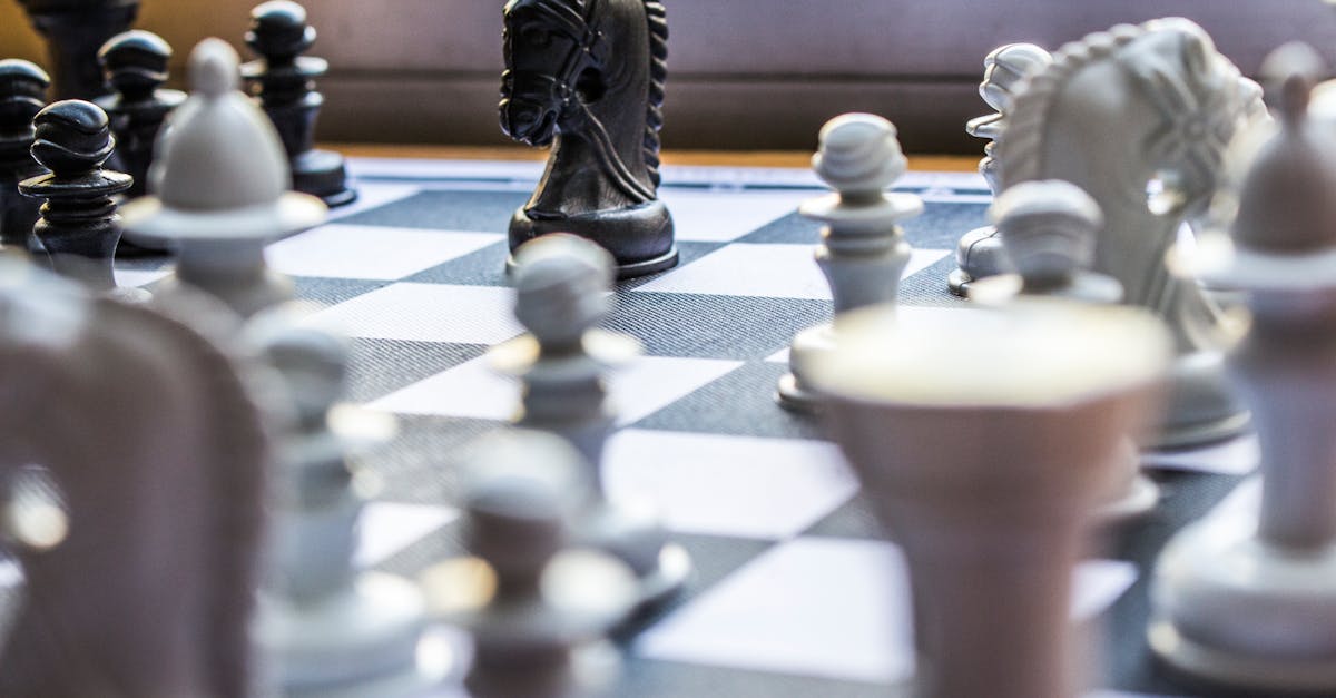 pexels-photo-3701276-3701276 Close-up of a chessboard with pieces in focus, highlighting strategic gameplay.